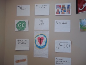 My wall of signs. Most of them are inside jokes.