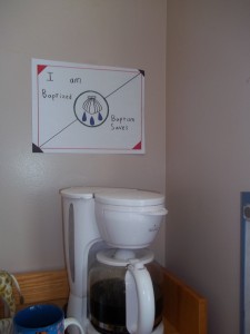 As a good Lutheran, I put my “Baptism Saves” sign near the coffeepot. 