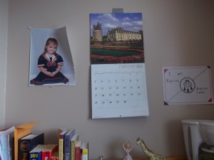 I like this calendar. It has pictures of castles every month. The picture next to it is my little sister. It’s very outdated; she’s ten and a half now.